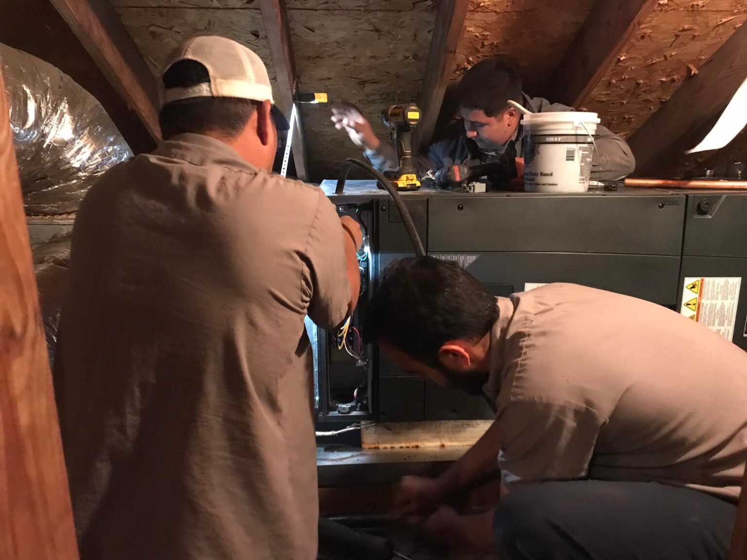Ibrahim, Juan and Jonathan doing an install